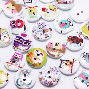 May include: Assortment of colourful wooden buttons featuring owl designs. The buttons are round and have a white background with various owl illustrations in different colours and patterns.