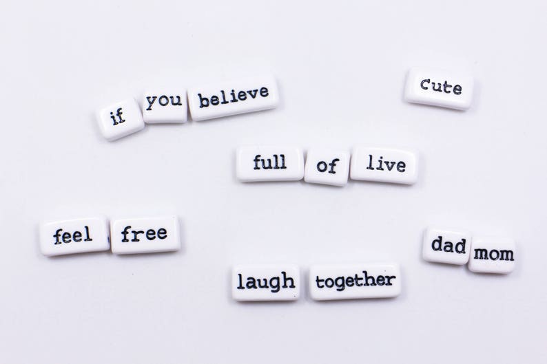 May include: White tiles with black lettering spelling out the phrase "if you believe feel free laugh together full of live cute dad mom".