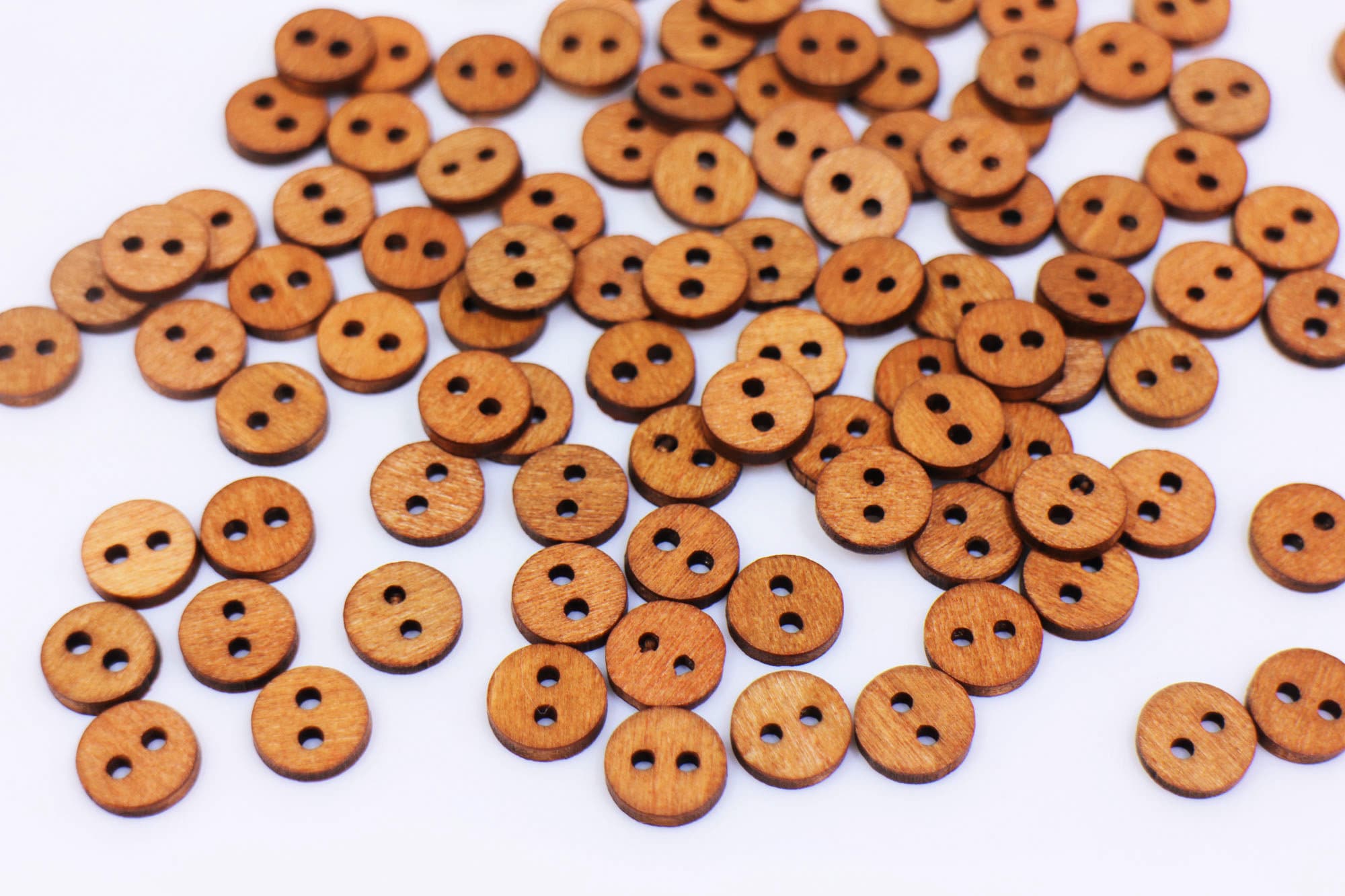 Plain two-hole wooden buttons, 2 sizes