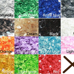 May include: A collection of 12 different colors of shredded satin ribbon. The colors are: whitesmoke, dark green, royal blue, silver, brown, cream, black, white, orange, light purple, light blue, light pink, yellow, light green, and red.