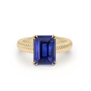 Blue Sapphire Claw Set Emerald Cut Textured 18K Yellow Gold Solitaire Ring