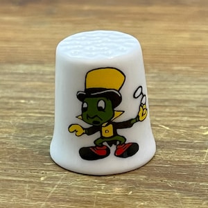 May include: A set of three ceramic mugs with a speckled, matte finish. The mugs are in shades of cream, light gray, and dark gray. Each mug has a simple, minimalist design, perfect for coffee or tea.