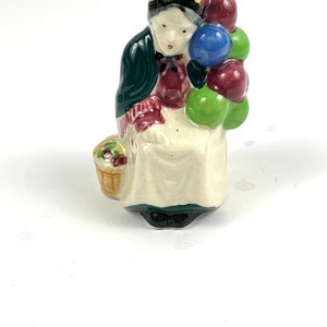 Vintage Occupied Japan Older Lady selling balloons figurine