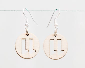 Earrings 11UD made of wood with an upside down eleven cut out.