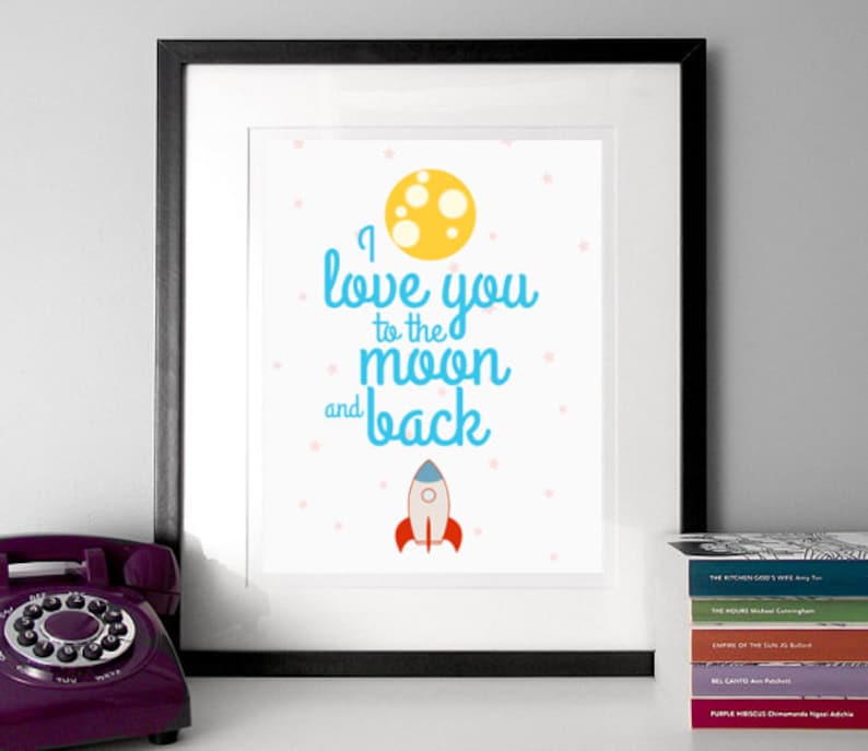 May include: A white framed print with a blue and yellow design. The print says "I love you to the moon and back" with a yellow moon and a blue rocket ship.