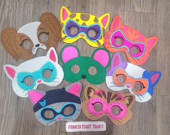 May include: A collection of colorful felt animal masks, including a dog, cat, and mouse, with various designs and accents. The masks feature bright colors like pink, orange, and blue, and are suitable for children's play or costume parties.