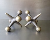 Oversized metal Jack sculptures. Mid century decor. Original.