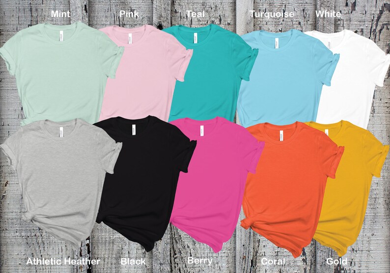 May include: Ten blank t-shirts in various colors, including mint, pink, teal, turquoise, white, athletic heather, black, berry, coral, and gold.