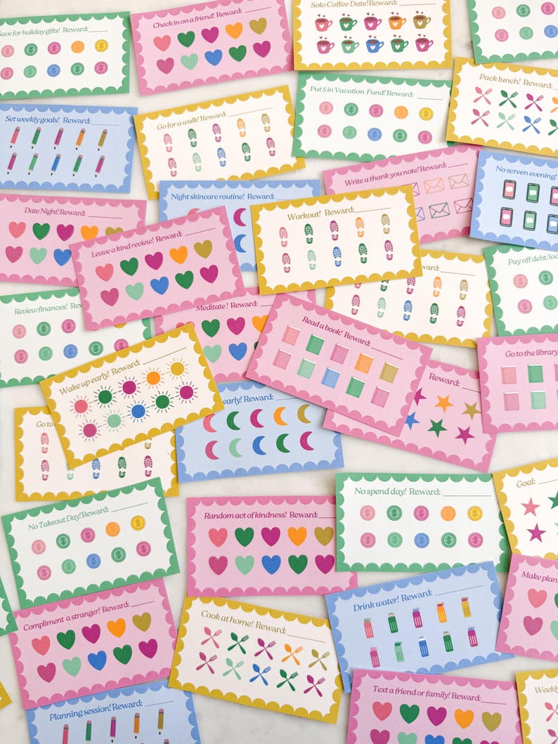 May include: A collection of colorful reward cards with scalloped edges. Each card features a different activity prompt, such as "Read a book!" or "No screen evening!" and includes space for tracking progress with hearts, stars, and other icons. The cards are in various pastel colors.