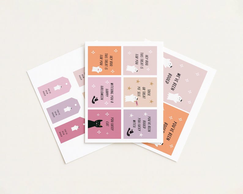 May include: A collection of Halloween-themed paper goods. The image features gift tags and cards with ghost and cat illustrations, along with phrases like "Hey Boo, this treat is for you" and "Witching you a Happy Halloween."