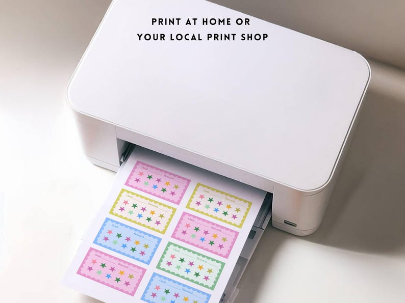 May include: A white printer printing colorful star-themed cards. The cards have a rectangular shape with a scalloped border and the text "Print at home or your local print shop". The cards are in various pastel colors.