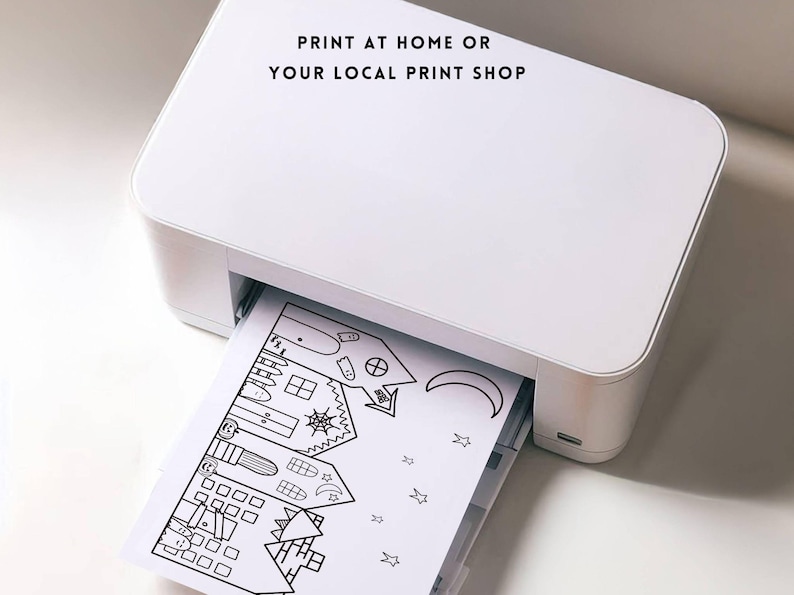 Puede incluir: Una impresora blanca imprimiendo un dibujo lineal en blanco y negro de una casa tem&aacute;tica de Halloween con una luna, estrellas y otros elementos espeluznantes. El texto "PRINT AT HOME OR YOUR LOCAL PRINT SHOP" est&aacute; en la parte superior.