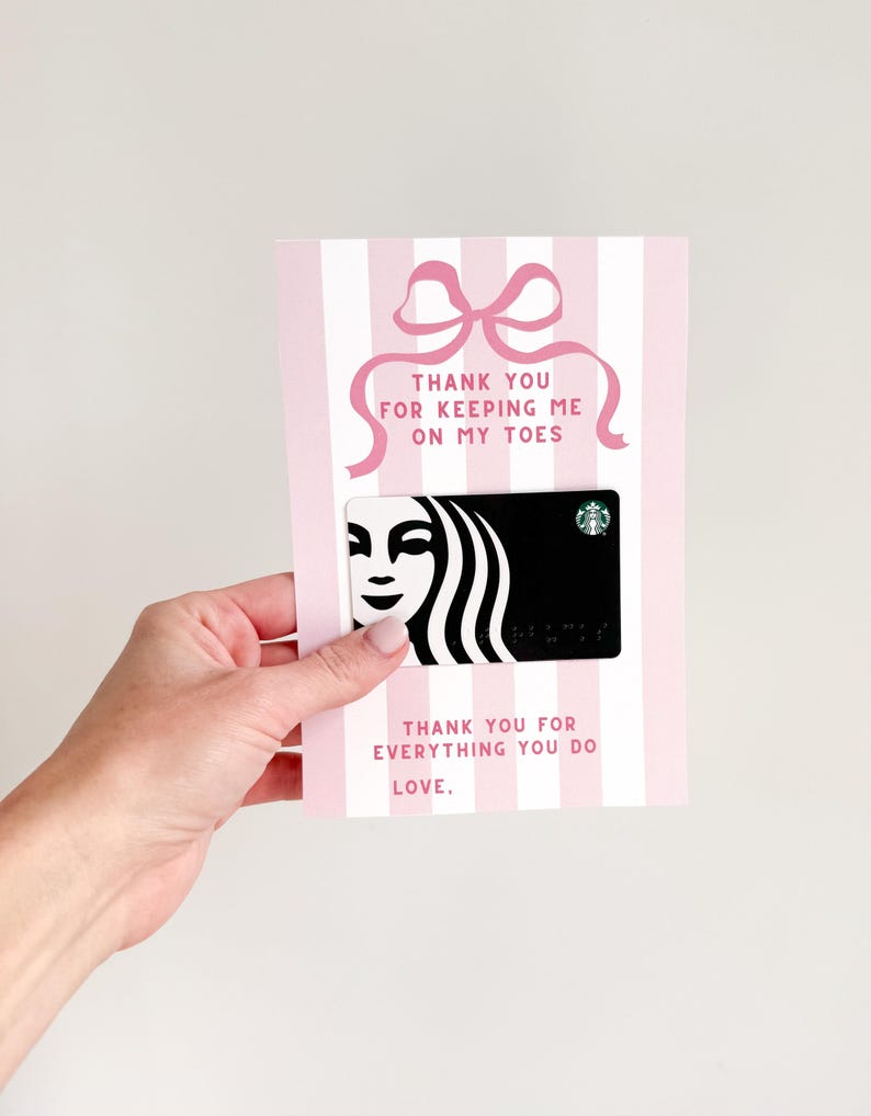 May include: Pink and white striped card with a pink bow and the text "Thank you for keeping me on my toes". A Starbucks gift card is attached to the card.