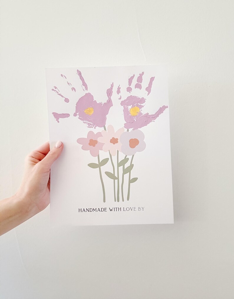 May include: A handmade card with a bouquet of pink and purple flowers made from handprints. The card reads "Handmade with love by".