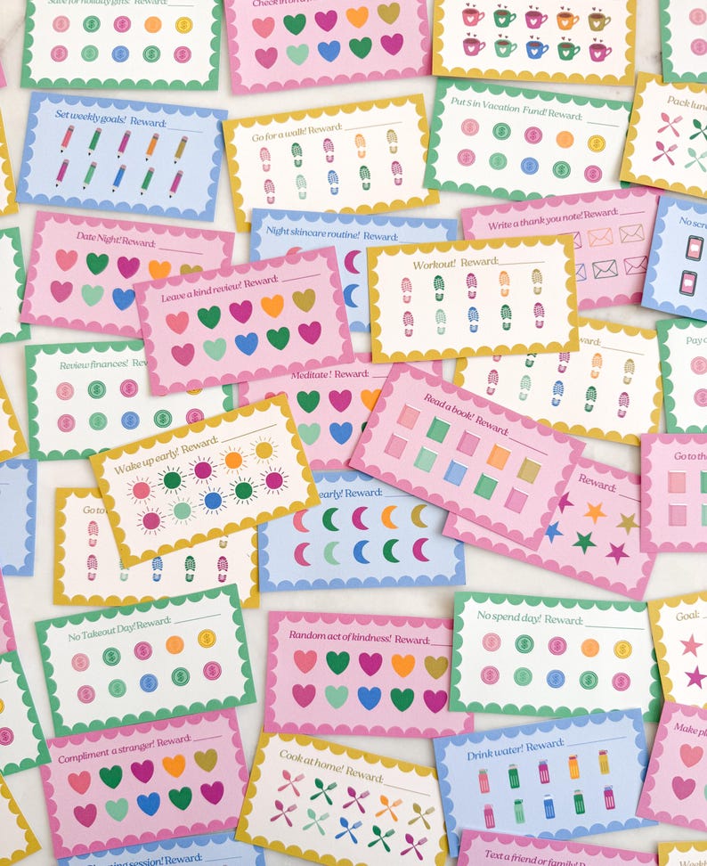 May include: A collection of colorful reward cards with various prompts and illustrations. Each card features a unique design, including hearts, pencils, footprints, and more. The cards are in shades of pink, blue, green, and yellow.