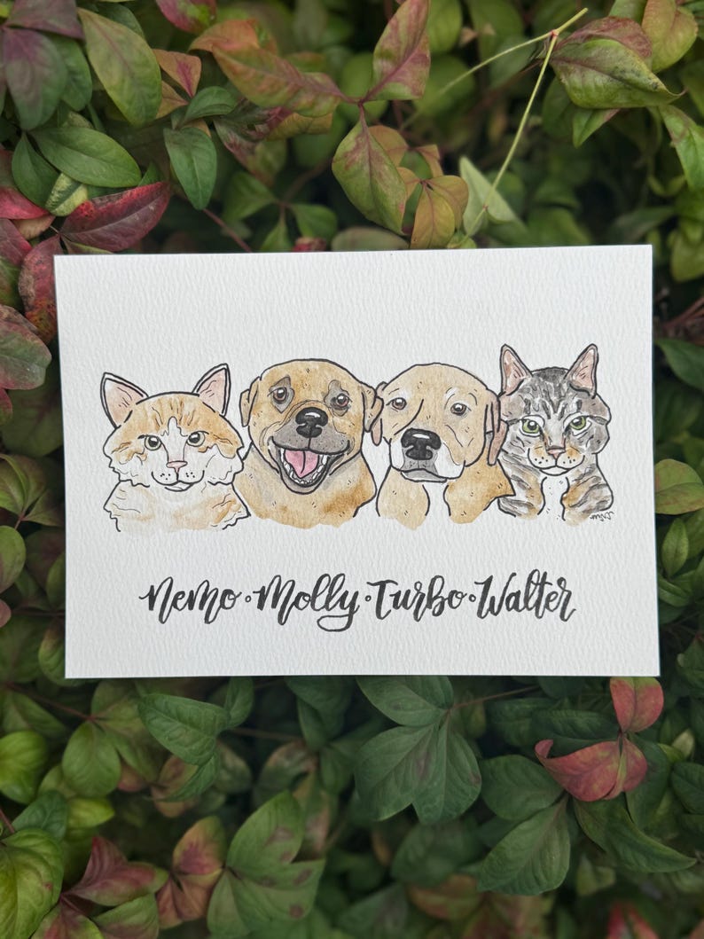 May include: Watercolor illustration of four pets: a cat, two dogs, and another cat. The pets are labeled with the names Nemo, Molly, Turbo, and Walter. The artwork is on a white rectangular card, set against a backdrop of green and red leaves.