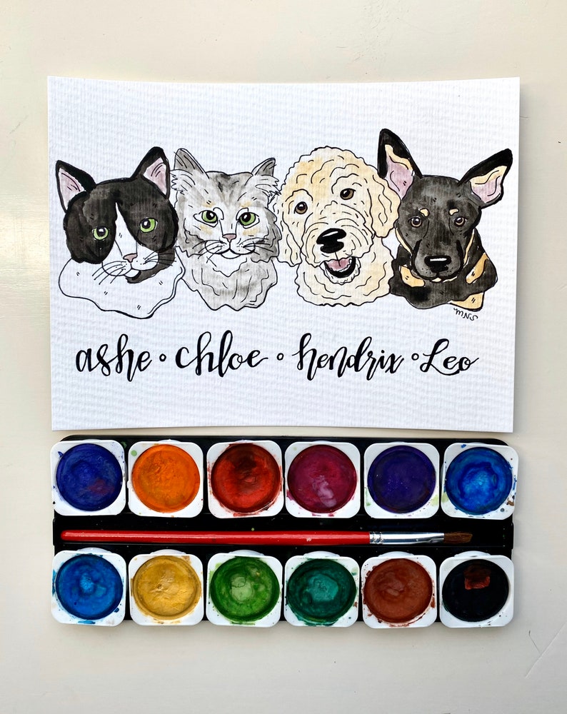 May include: A watercolor painting of four pets: a black and white cat, a gray cat, a golden doodle, and a black and tan dog. The names "ashe", "chloe", "hendrix", and "Leo" are written below. A watercolor paint set and brush are below.