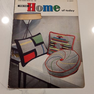May include: A vintage crochet pattern book titled "For the Home of Today" with a cover image of three crocheted pillows in red, green, blue, yellow, and white on a white bench.