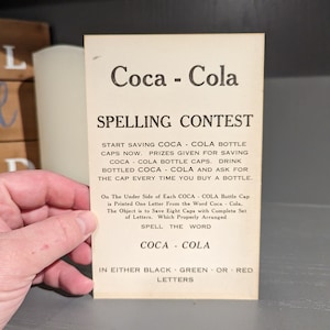1920's Coca-Cola Spelling Contest Bottle Topper - Old & Original Bottle Hanger - NOS New Old Stock