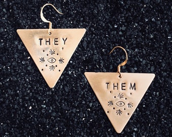 Pronoun earrings: customizable queer jewelry, golden brass triangles with eyes