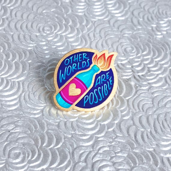 Other Worlds Are Possible pin, recycled brass