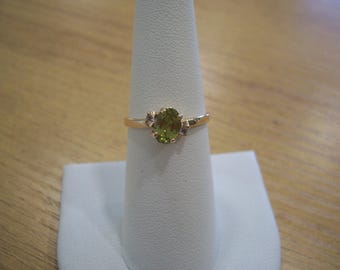 Vintage Natural Oval Peridot Ring in Yellow Gold with White Topaz Accent Stones