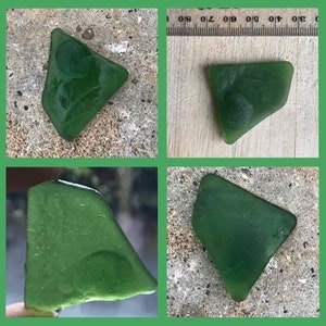May include: Four images of sea glass pieces. Each piece is a deep green colour, with a smooth, rounded shape. The glass appears to have been tumbled by the ocean. One piece has a small, circular indentation. The pieces are displayed on a concrete surface.