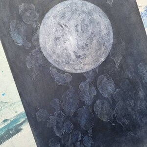 May include: A black canvas with a white circle in the center and white leaf-shaped patterns around it.