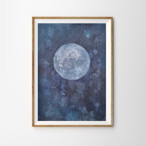 May include: A framed painting of a large, white moon on a dark blue background with white and blue speckles.