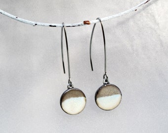 Long ceramic earrings. Pearly white and silver charm with surgical steel hooks. Minimalist earrings handmade in France.