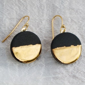 Black and gold ceramic earrings. Porcelain disc and gold plated surgical steel ear hooks. Minimalist earrings handmade in France. image 5