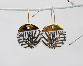 Black leaf design. Large earrings in white porcelain and 22K gold luster. Handmade ceramic disc earrings.