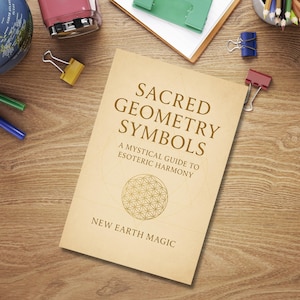 May include: A book titled "Sacred Geometry Symbols" with the subtitle "A Mystical Guide to Esoteric Harmony" and the words "New Earth Magic" at the bottom. The book is on a wooden surface with office supplies.