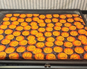 Two basketball design flannel, pillowcase style tray liners for ferret/critter nation cage