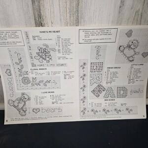 May include: A cross-stitch pattern sheet featuring various designs, including a teddy bear, floral ribbon, and the text "HARE'S MY HEART" and "I LOVE BEARS". The sheet includes color and stitch guides for each design.