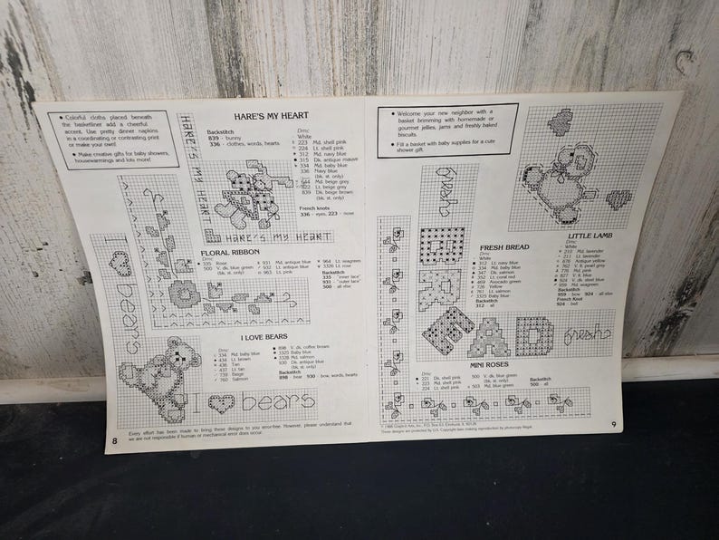 May include: A cross-stitch pattern sheet featuring various designs, including a teddy bear, floral ribbon, and the text "HARE'S MY HEART" and "I LOVE BEARS". The sheet includes color and stitch guides for each design.