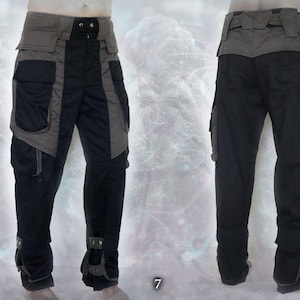 May include: Black and gray cargo pants with multiple pockets and a belt. The pants have a unique design with contrasting panels and zippers.