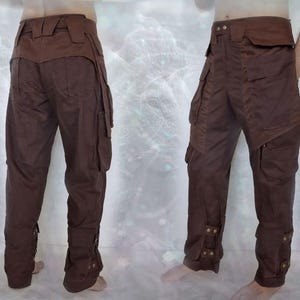 May include: Brown cargo pants with multiple pockets and adjustable straps at the ankles.