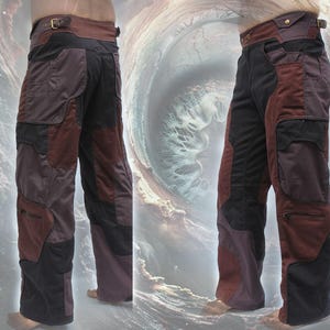 May include: A pair of black and burgundy cargo pants with multiple pockets and a belt. The pants are made of a durable, textured fabric.