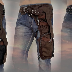 May include: Three different styles of thigh-high leg bags worn over jeans. The bags are made of black, brown, and orange fabric and have multiple pockets and straps.
