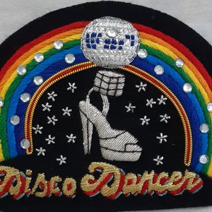 May include: Embroidered patch with a rainbow, a disco ball, a silver high heel shoe, and the text "Disco Dancer".