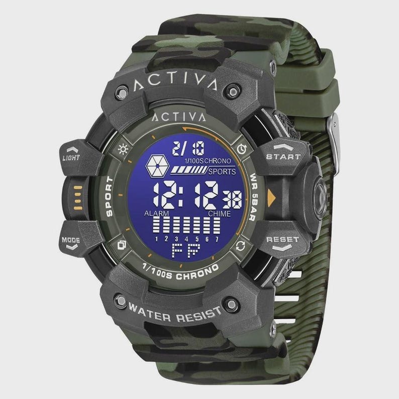 May include: A digital wristwatch with a camouflage pattern strap and case. The watch face features a blue backlit display showing the time 12:12, the date 2/10, and text including ACTIVA, 1/100S CHRONO, SPORTS, ALARM, CHIME, and WATER RESIST.