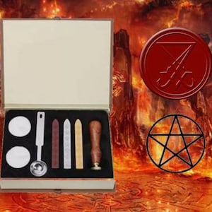 May include: A wooden box with a red wax seal, a pentagram, and a set of tools for sealing wax. The tools include a spoon, a knife, and several sticks of wax.