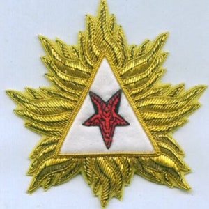 May include: A gold embroidered patch with a white triangle containing a red five-pointed star with a black pentagram inside. The triangle is surrounded by a gold embroidered starburst.