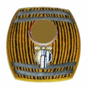 May include: A round, wooden barrel-shaped bottle stopper with a gold trim. The stopper has a brown center with a white and blue propeller design.