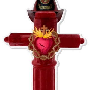 May include: A red fire hydrant shaped like a cross with a golden heart and flames on top. The hydrant is topped with a firefighter's helmet with the words "American Fire Fighter" on it.