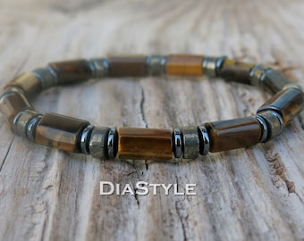 May include: A brown and gold beaded bracelet with black beads. The bracelet is made of tiger's eye and hematite stones.