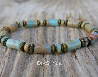 May include: A bracelet made with light blue, brown, and beige rectangular beads with gold accents.