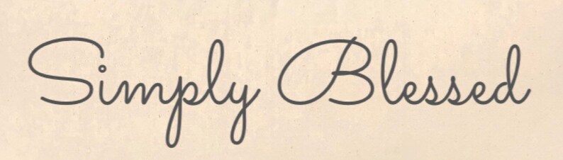 May include: A simple handwritten inscription that reads "Simply Blessed".