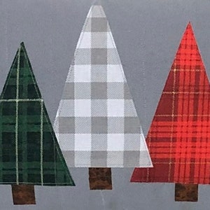 May include: Three fabric Christmas trees in a row. The tree on the left is green with a plaid pattern. The middle tree is white and gray with a gingham pattern. The tree on the right is red with a plaid pattern.